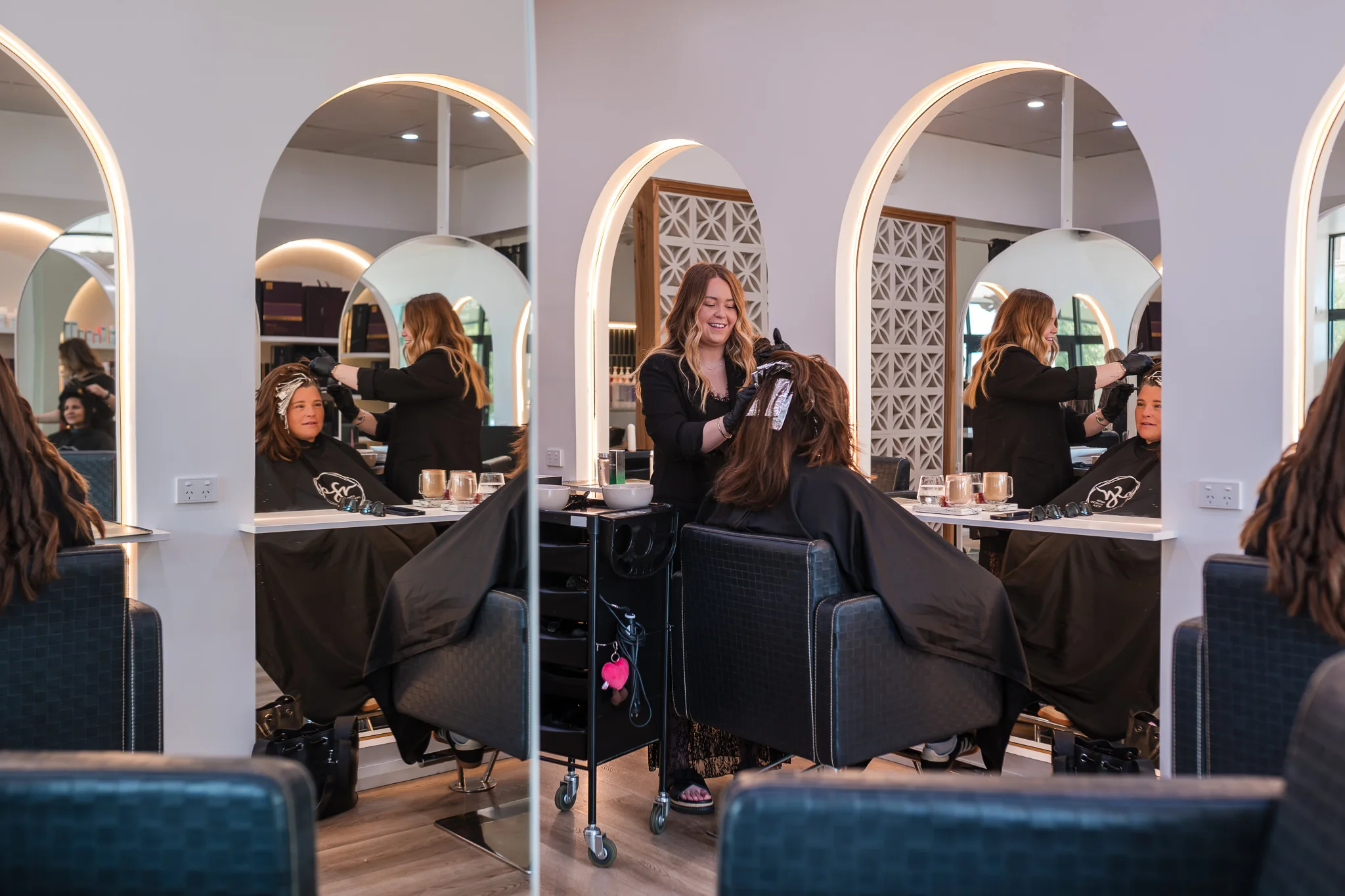 Stylists working with guests in the salon